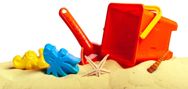 istock Plastic children toys on the sand beach 949343042