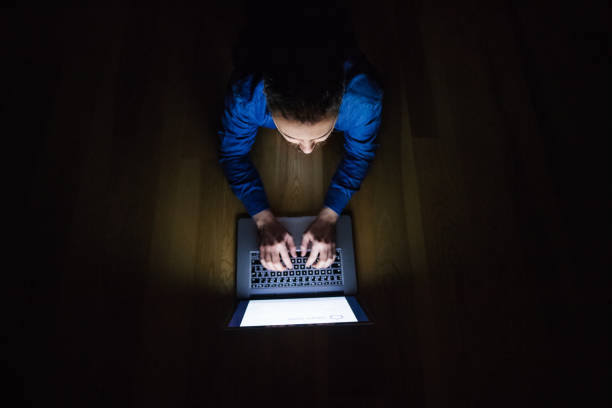 istock A man working on a laptop at home at night. 949346288