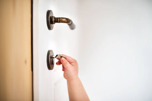 Deadbolt on an old white door not locked