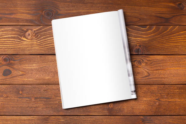 Blank book or magazine cover on wood background