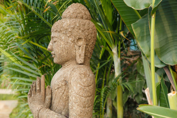 istock Grunge vintage retro buddha statue in nature 949350272