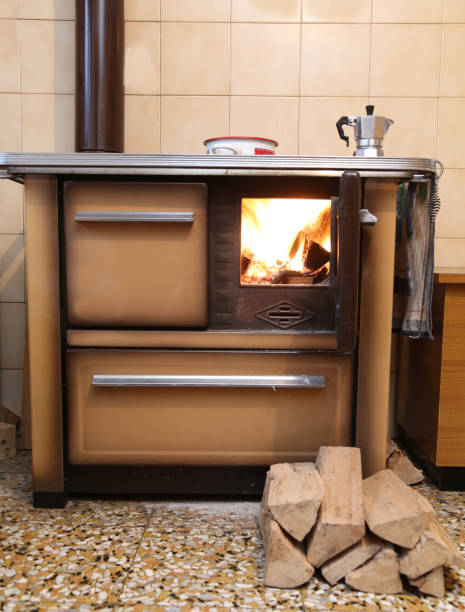 istock old wood-burning stove in the kitchen with fire 949352112
