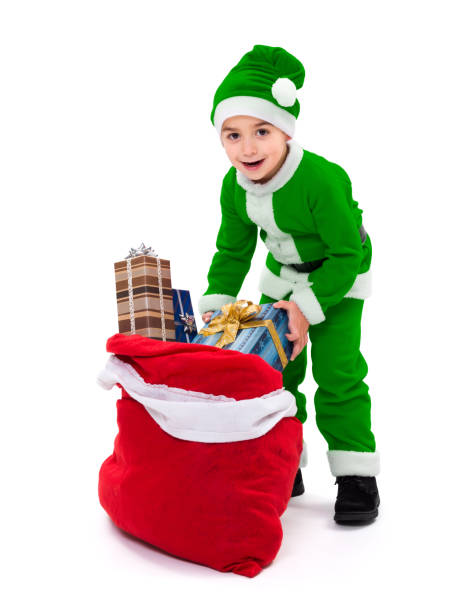 istock Little green Santa Claus boy with gift bag 949352624