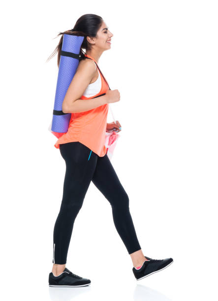 istock Woman in exercise clothes walking 949355840