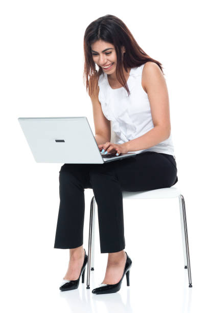 istock Businesswoman seated and using laptop 949355952