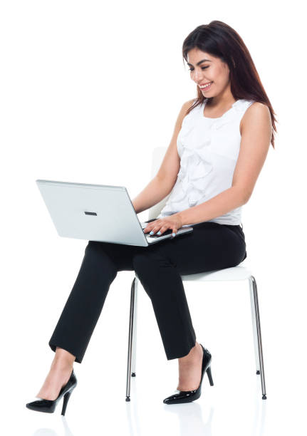 istock Businesswoman seated and using laptop 949355964