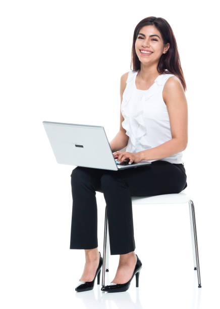 istock Businesswoman seated and using laptop 949355972