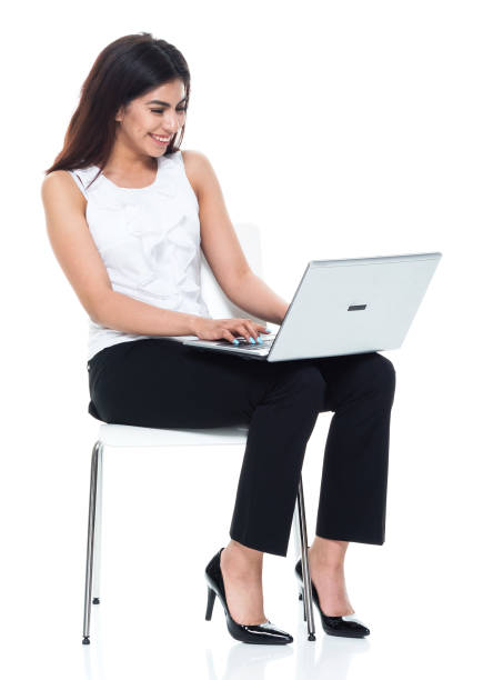 istock Businesswoman seated and using laptop 949355974