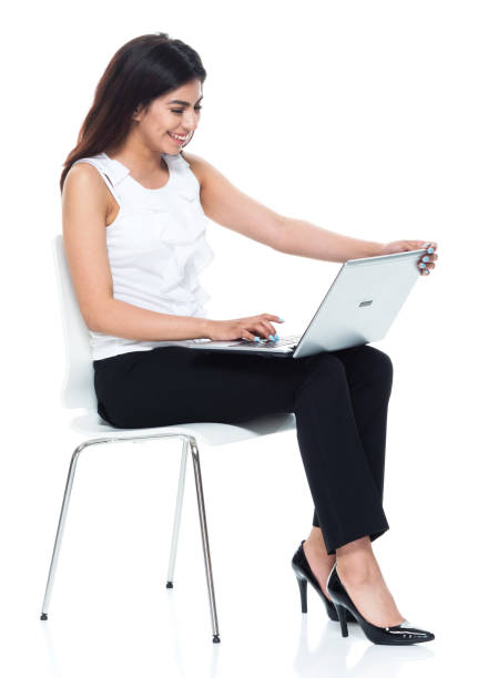 istock Businesswoman seated and using laptop 949355980