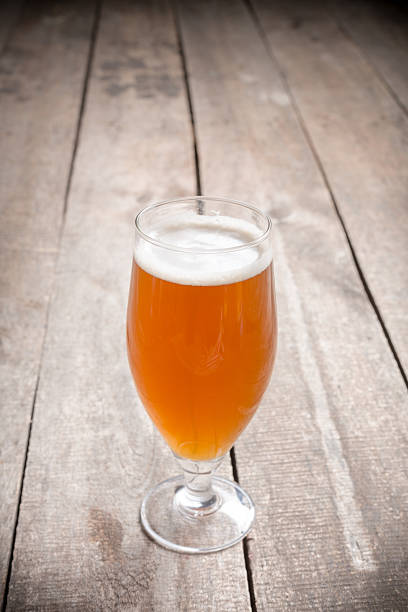 istock glass beer on wood background 949355986