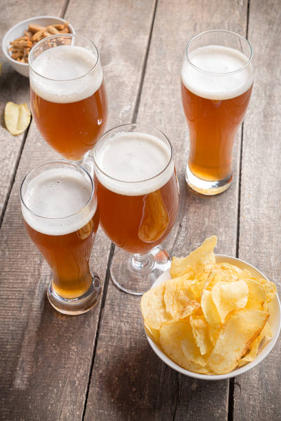 istock glass beer on wood background 949356014