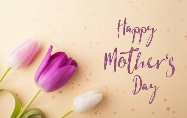 istock Happy mothers day sign and flowers composition. Studio shot. 949356244
