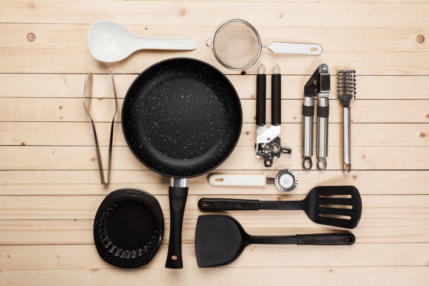 istock cookware and accessories on a wooden table. 949375618