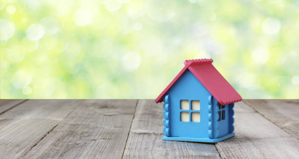 istock Small wooden house on blurred nature background. 949377168