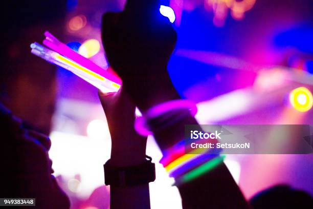 Nightclub Silhouette Of People Having Fun Stock Photo - Download Image Now - Glow Stick, Party - Social Event, Neon Colored