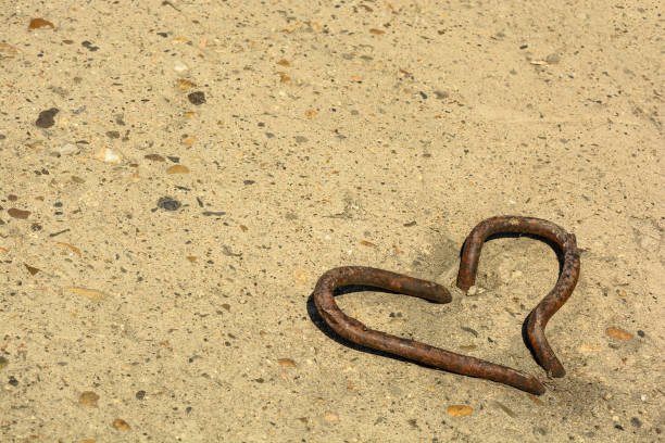 istock metal heart and copyspace on a concrete surface 949384586
