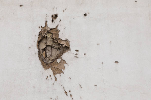 Bullet hole on building wall in Sarajevo stock photo