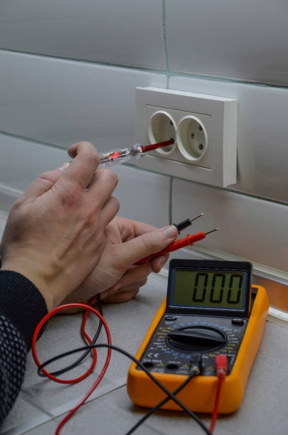 istock The electrician's hands hold the tester 949390438