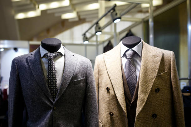 istock Men's jackets on hangers in the men's store 949396202