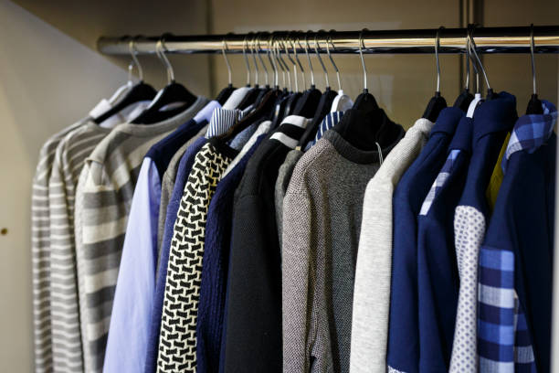 istock School clothes for boy and girl on hanger 949396544