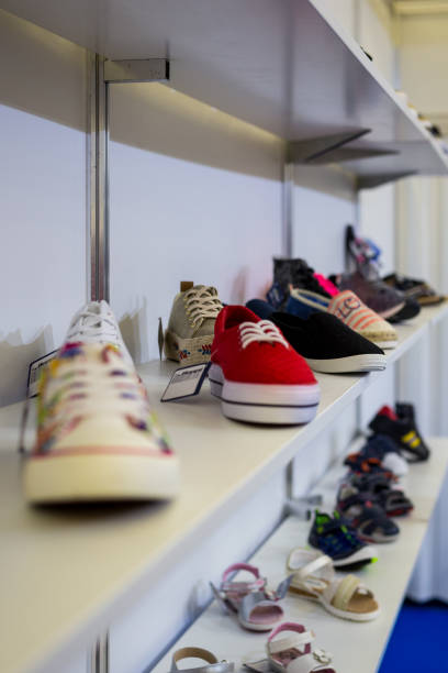 istock women's & men's shoes in a store 949397270