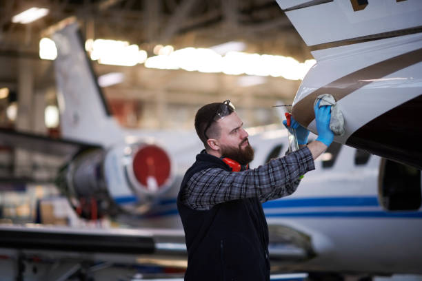 Aircraft mechanic in the hangar stock photo