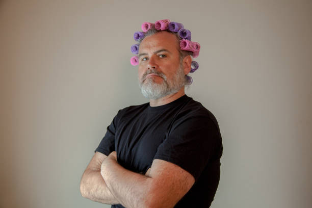 018_2018_Man with head full of hair rollers stock photo