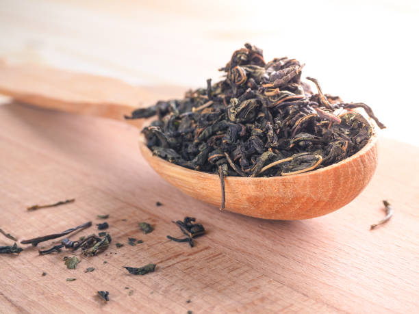 istock Loose tea in a wooden dish with a spoon. 949403714