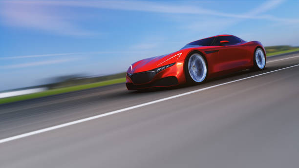 istock red car driving on a road 949404282