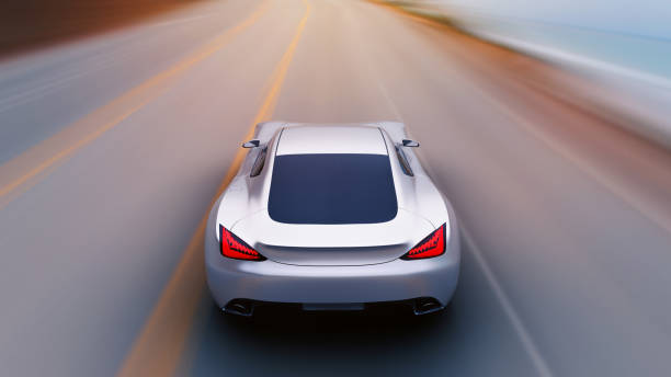 istock gray car driving on a road by sea 949404284
