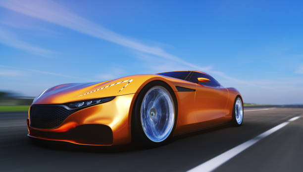 istock orange car driving on a road 949404298