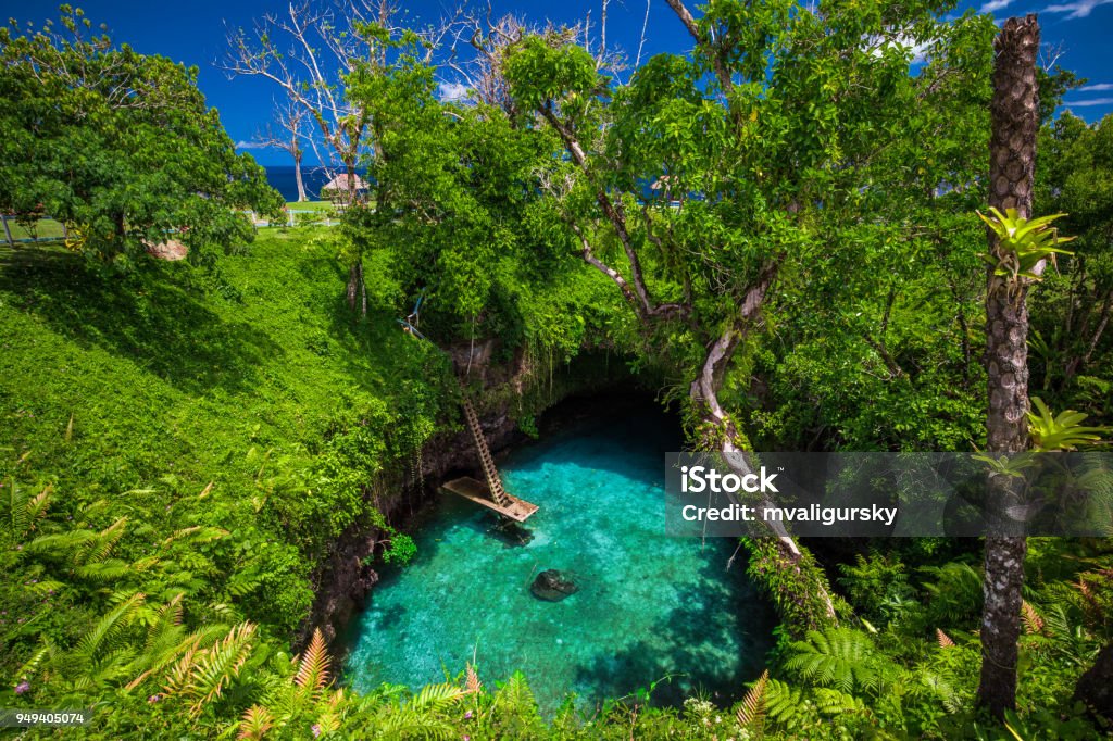 To Sua ocean trench - famous swimming hole, Upolu, Samoa, South Pacific To Sua ocean trench - famous swimming hole, Upolu, Samoa Islands, South Pacific Trench Stock Photo