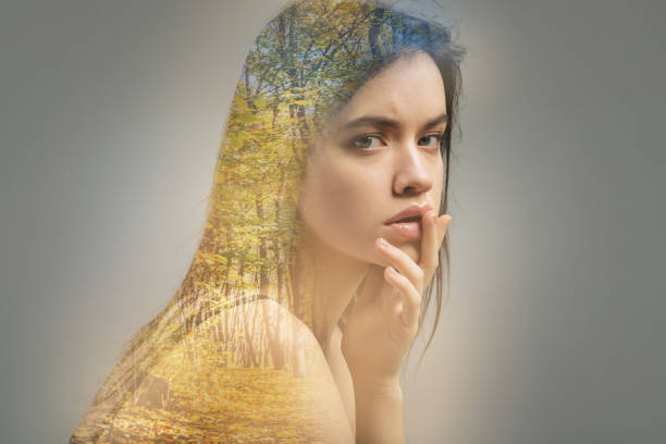 istock Beautiful woman touching her lips while sitting alone 949405572