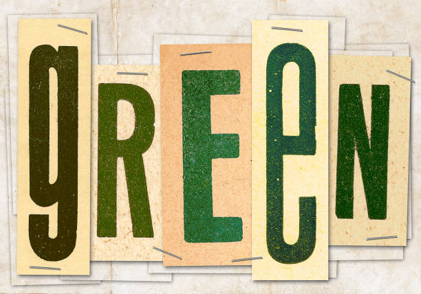 The word of color green made of vintage letters and papers with staples