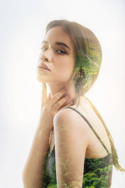 istock Pretty woman sitting round shouldered and touching her neck 949406478