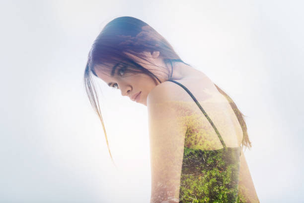 istock Young person looking into the distance and standing round shouldered 949406598