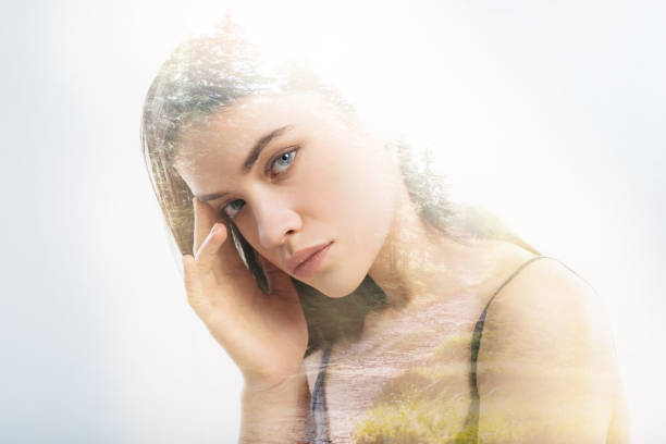 istock Beautiful woman touching her temple while thinking 949408674