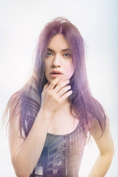 istock Young woman touching her lips and having messy hair 949408762