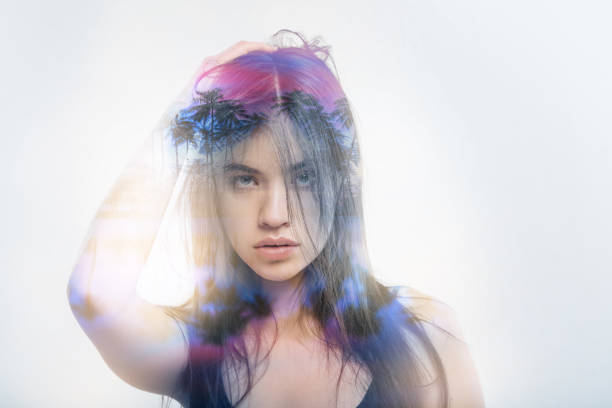 istock Young woman looking serious while touching her messy hair 949408764