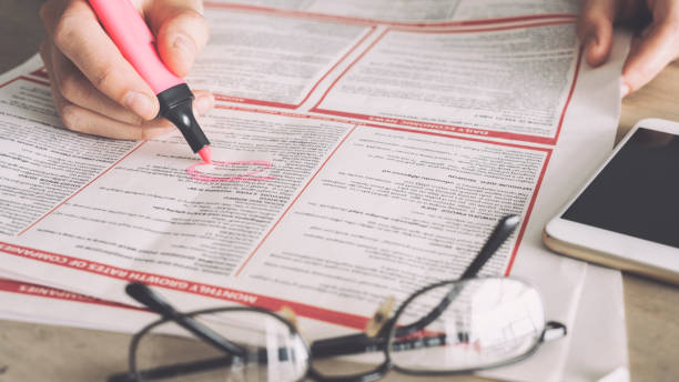 istock Searching for a job from a newspaper 949409416