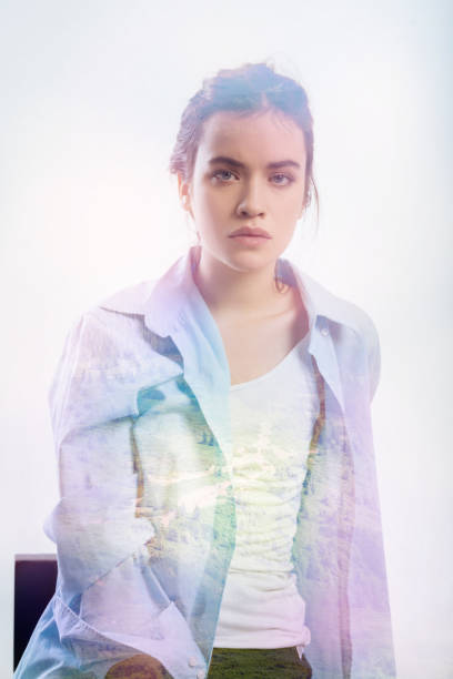 istock Calm person sitting alone and looking straight without a smile 949409450