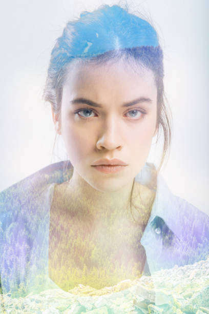 istock Calm woman frowning while standing against the grey background 949409486