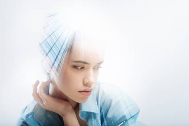 istock Pretty young person looking to the left and touching her neck 949411896