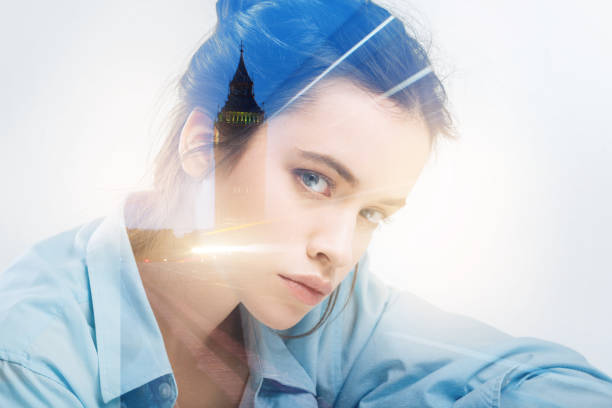 istock Serious young teacher sitting at the table and looking strict 949411940
