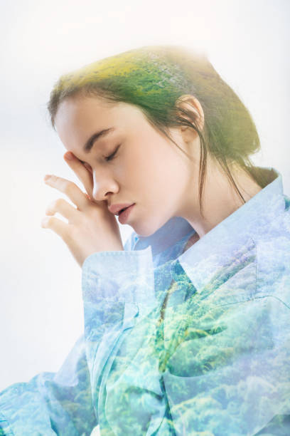 istock Cute woman touching her closed eyes and feeling sleepy 949412168