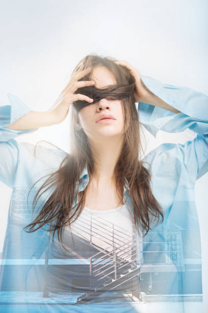 istock Creative person hiding her face and looking strange 949412432