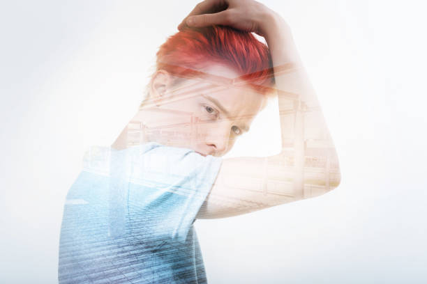 istock Handsome man touching his head while admiring his new hair color 949412666