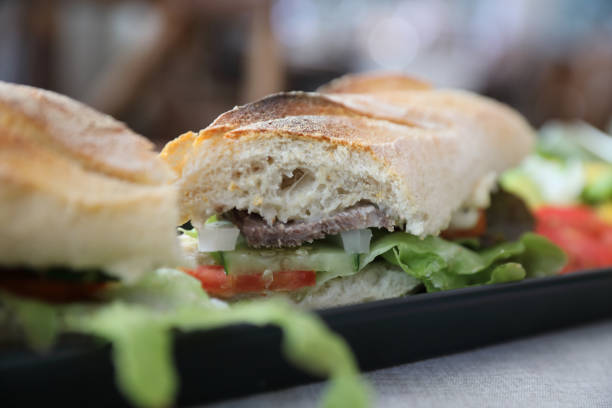 istock Beef sandwich on wood background 949418522