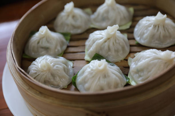 istock Dim sum dumpling on bamboo basket , Chinese food 949420906