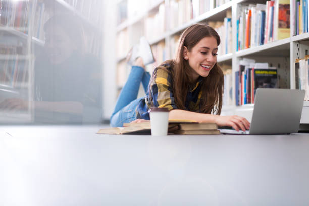 istock Young female student studying in the library 949425114